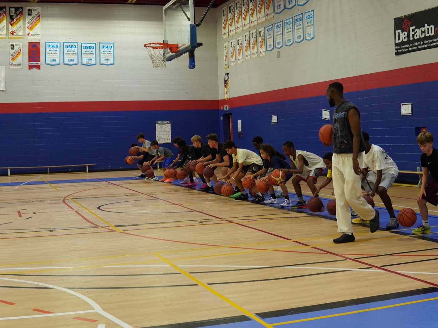 Check Up Basketball players working through a dribbling line drill